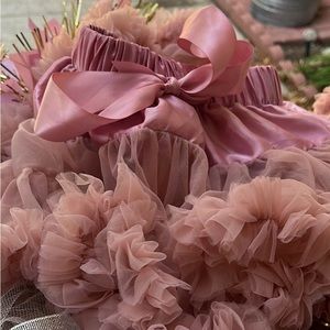 Beautiful “Onederland” birthday decor! Including custom onesie,skirt, and more!